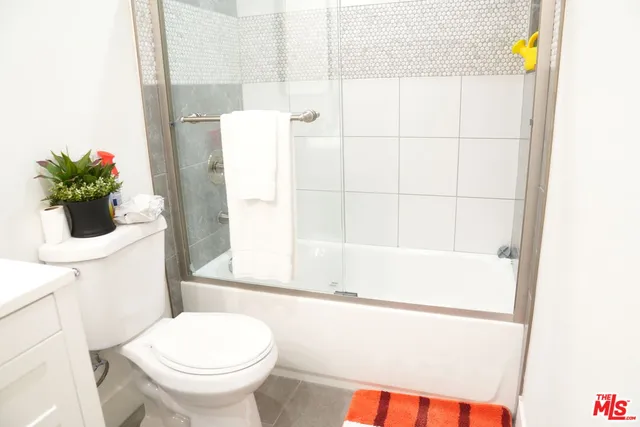 a bathroom with a shower and a toilet