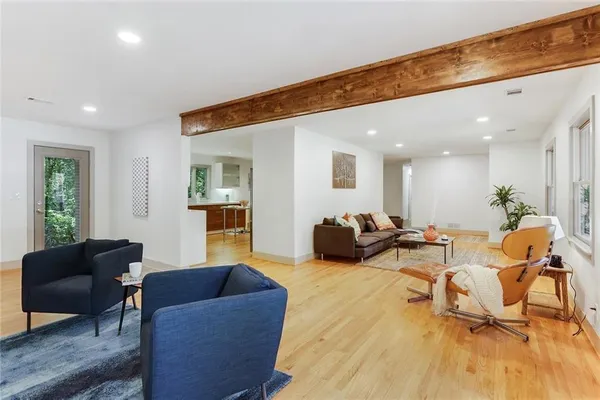 a living room with furniture and a table