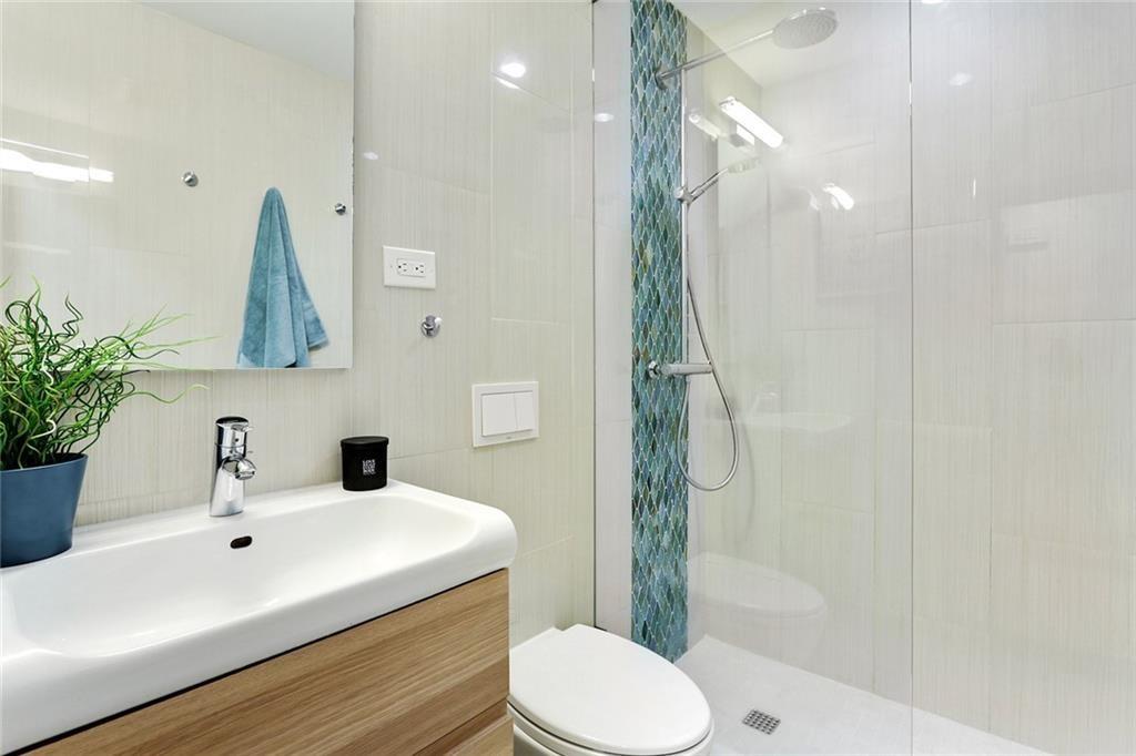 1995 Commodore Lane Atlanta, GA 30341 - Photo 18 of 31 a bathroom with a sink toilet and shower