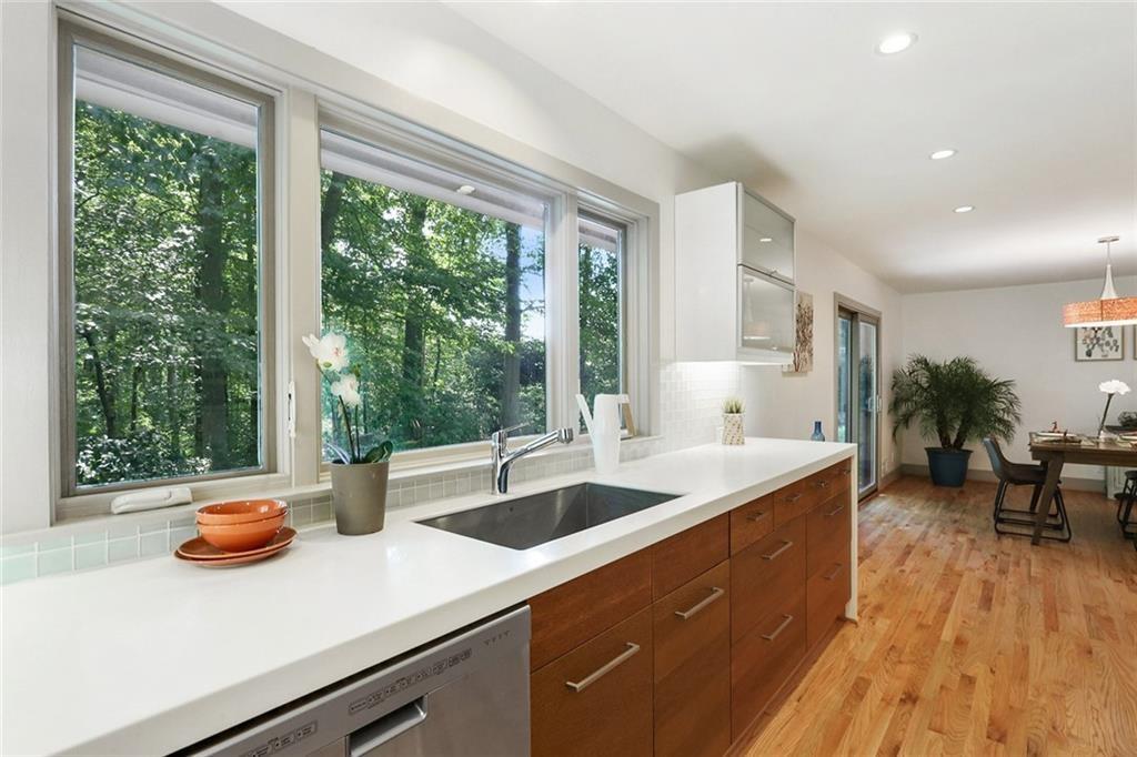 1995 Commodore Lane Atlanta, GA 30341 - Photo 20 of 32 a kitchen with a sink and wooden floor