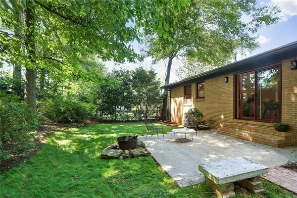 a backyard of a house with seating space
