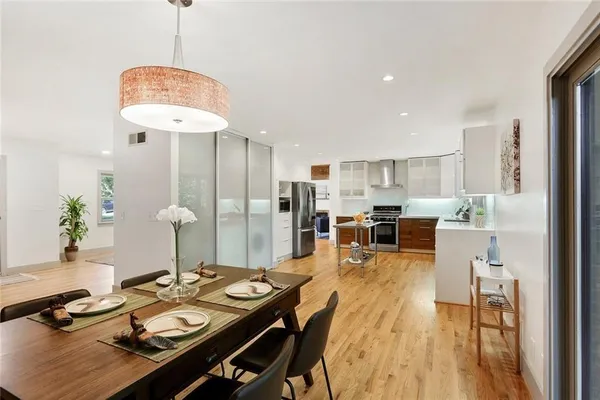 a dining room with furniture and a chandelier