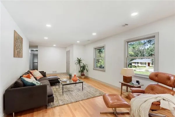 a living room with furniture and a window