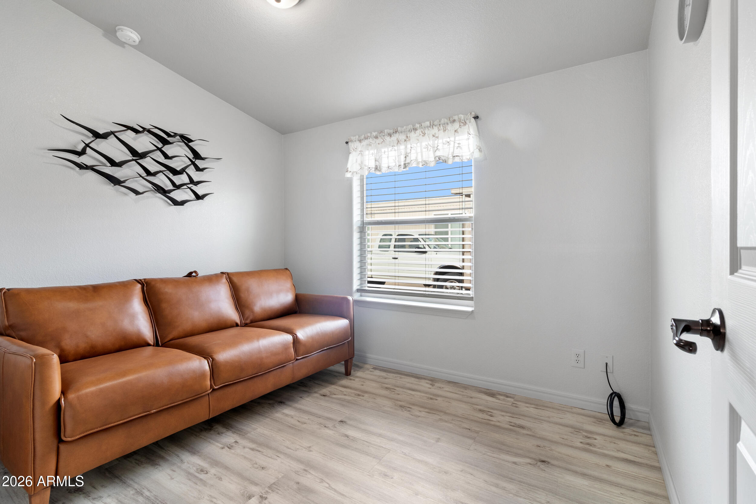 10936 East Apache Trail, Unit 121 Apache Junction, AZ 85120 - Photo 4 of 10 a living room with furniture and a window