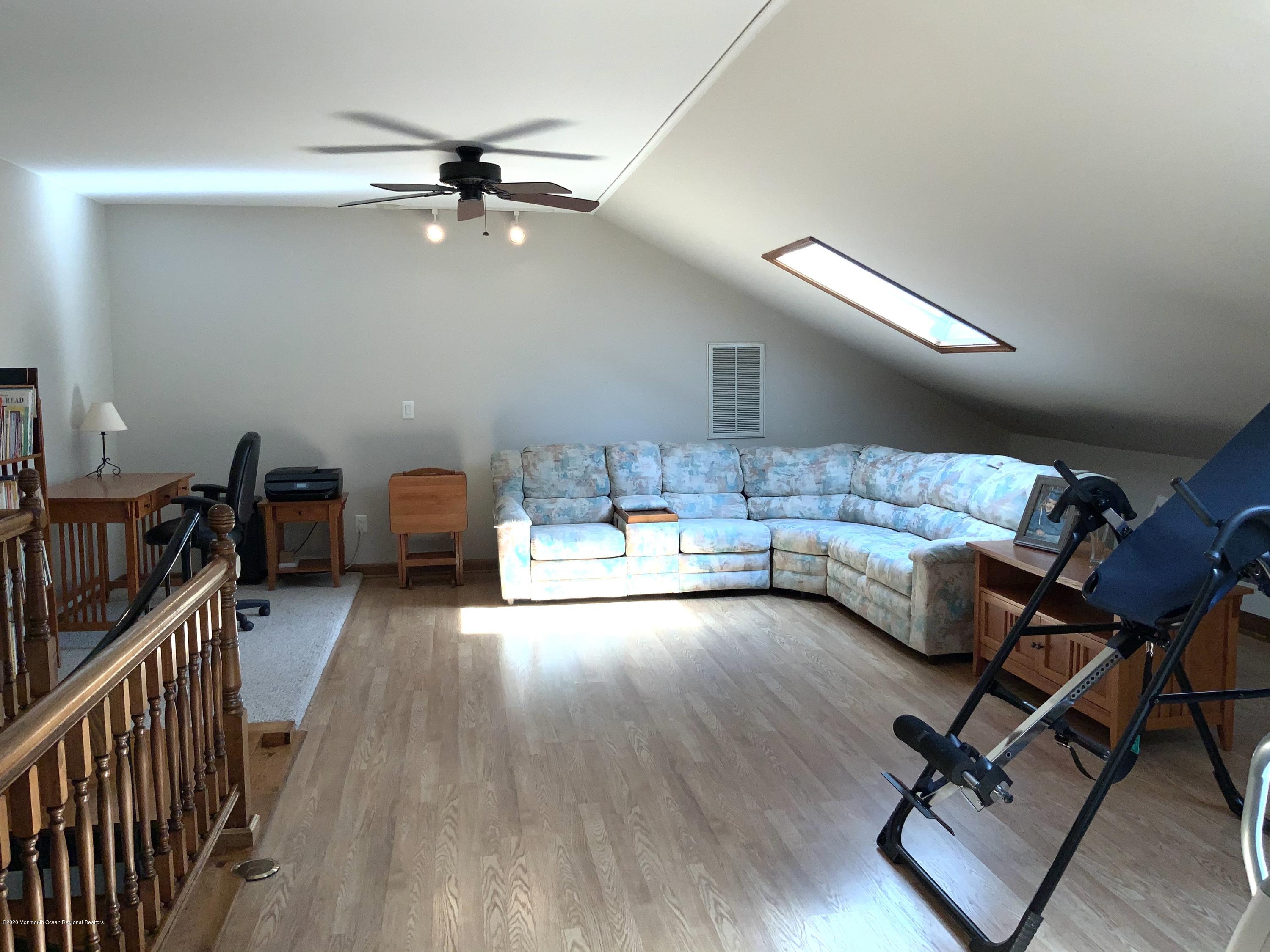 202 Pleasant Drive Brick, NJ 08723 - Photo 14 of 46 a view of a livingroom with furniture and a ceiling fan