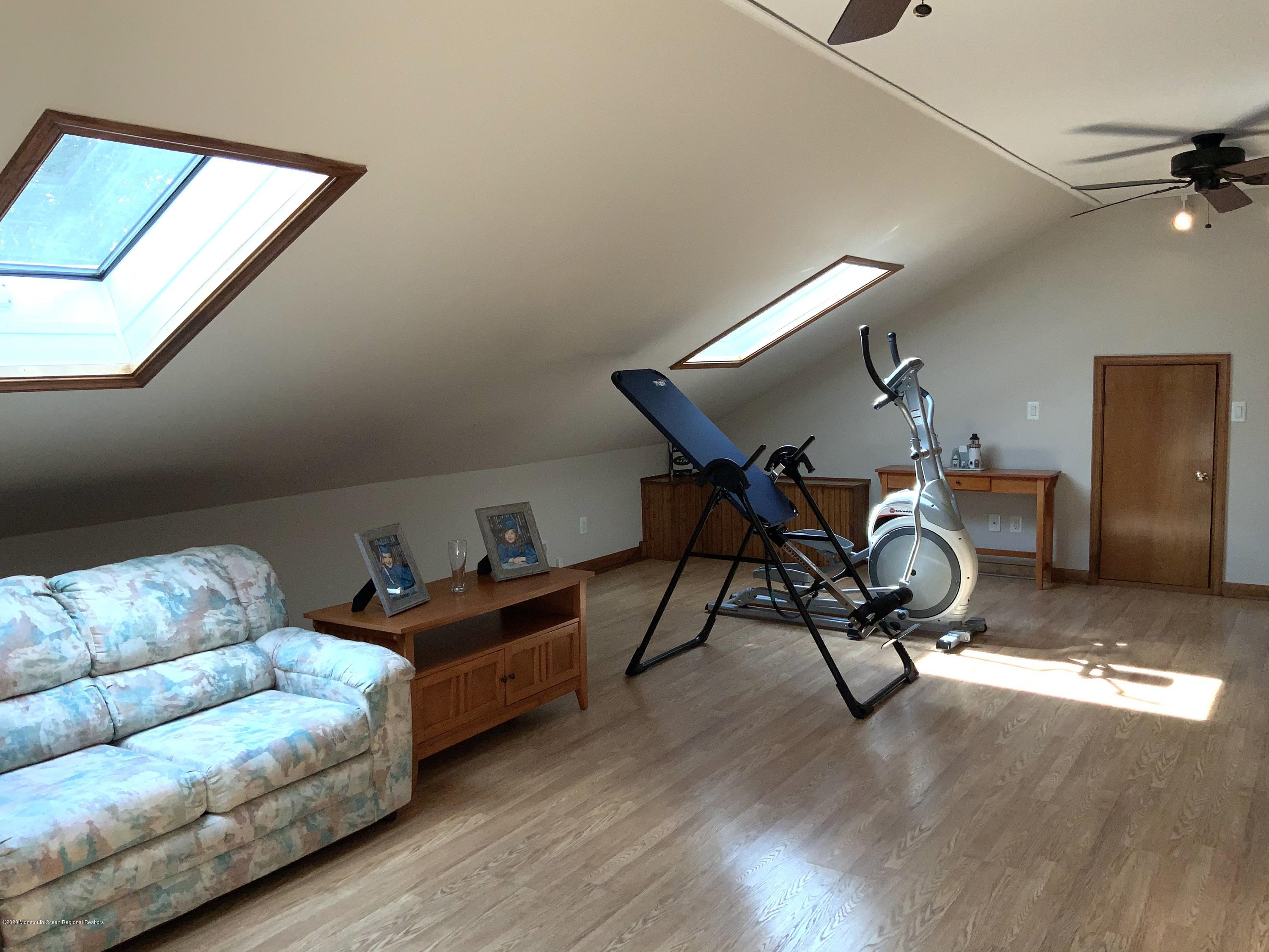 202 Pleasant Drive Brick, NJ 08723 - Photo 15 of 46 a living room with furniture and a wooden floor
