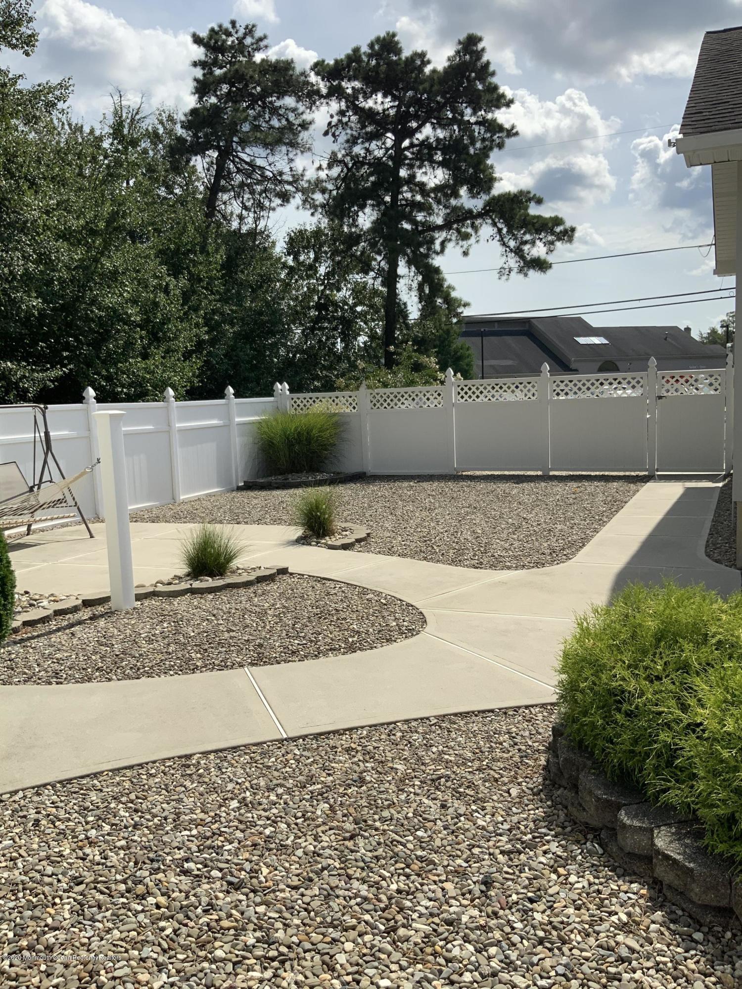 202 Pleasant Drive Brick, NJ 08723 - Photo 19 of 46 a view of a backyard of the house