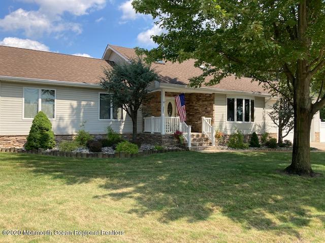 202 Pleasant Drive Brick, NJ 08723 - Photo 2 of 46 a front view of a house with a garden