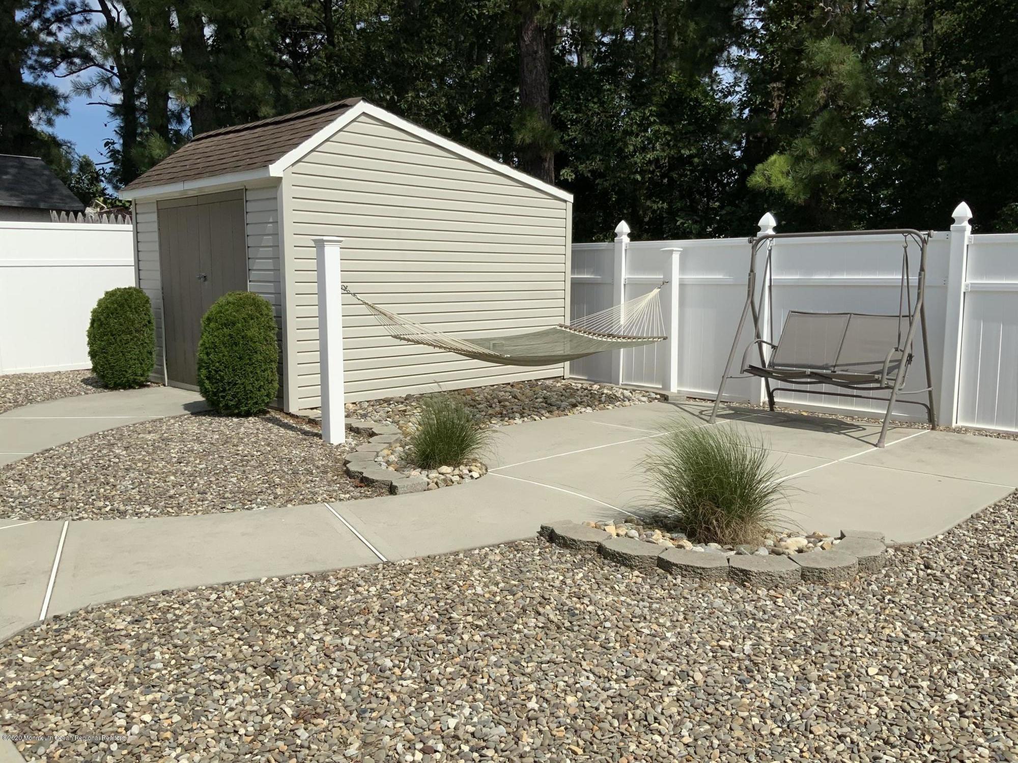 202 Pleasant Drive Brick, NJ 08723 - Photo 21 of 46 a view of a house with a yard