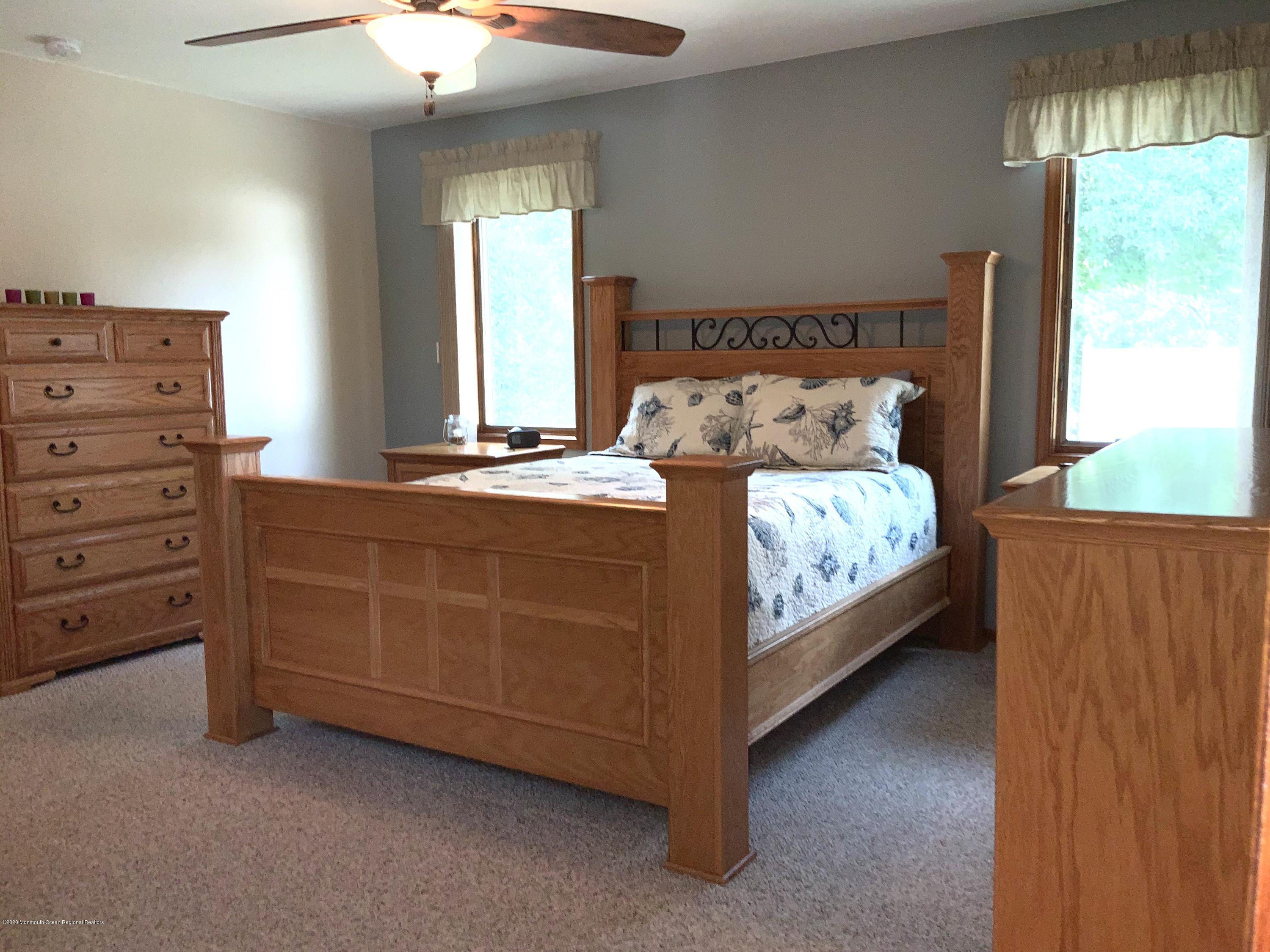 202 Pleasant Drive Brick, NJ 08723 - Photo 24 of 46 a bedroom with a bed and a dresser
