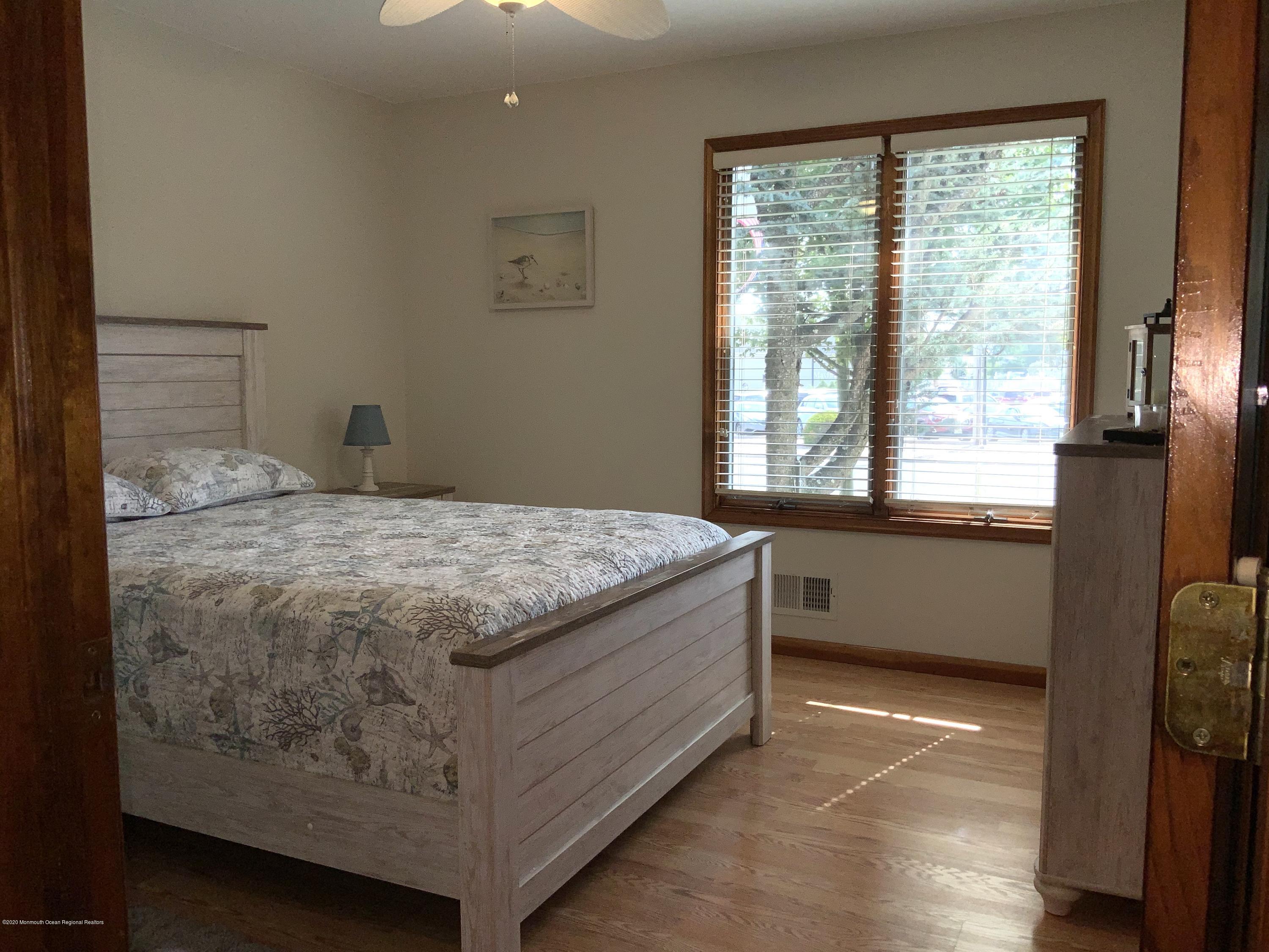 202 Pleasant Drive Brick, NJ 08723 - Photo 30 of 46 a bedroom with a bed and a window