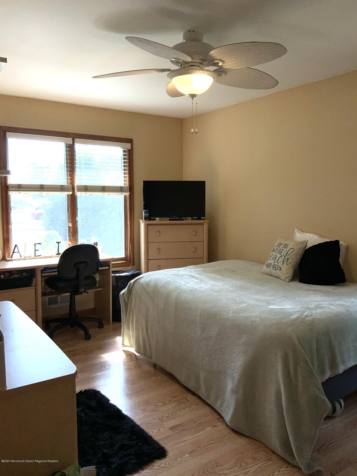 202 Pleasant Drive Brick, NJ 08723 - Photo 32 of 46 a bedroom with a bed and a large window