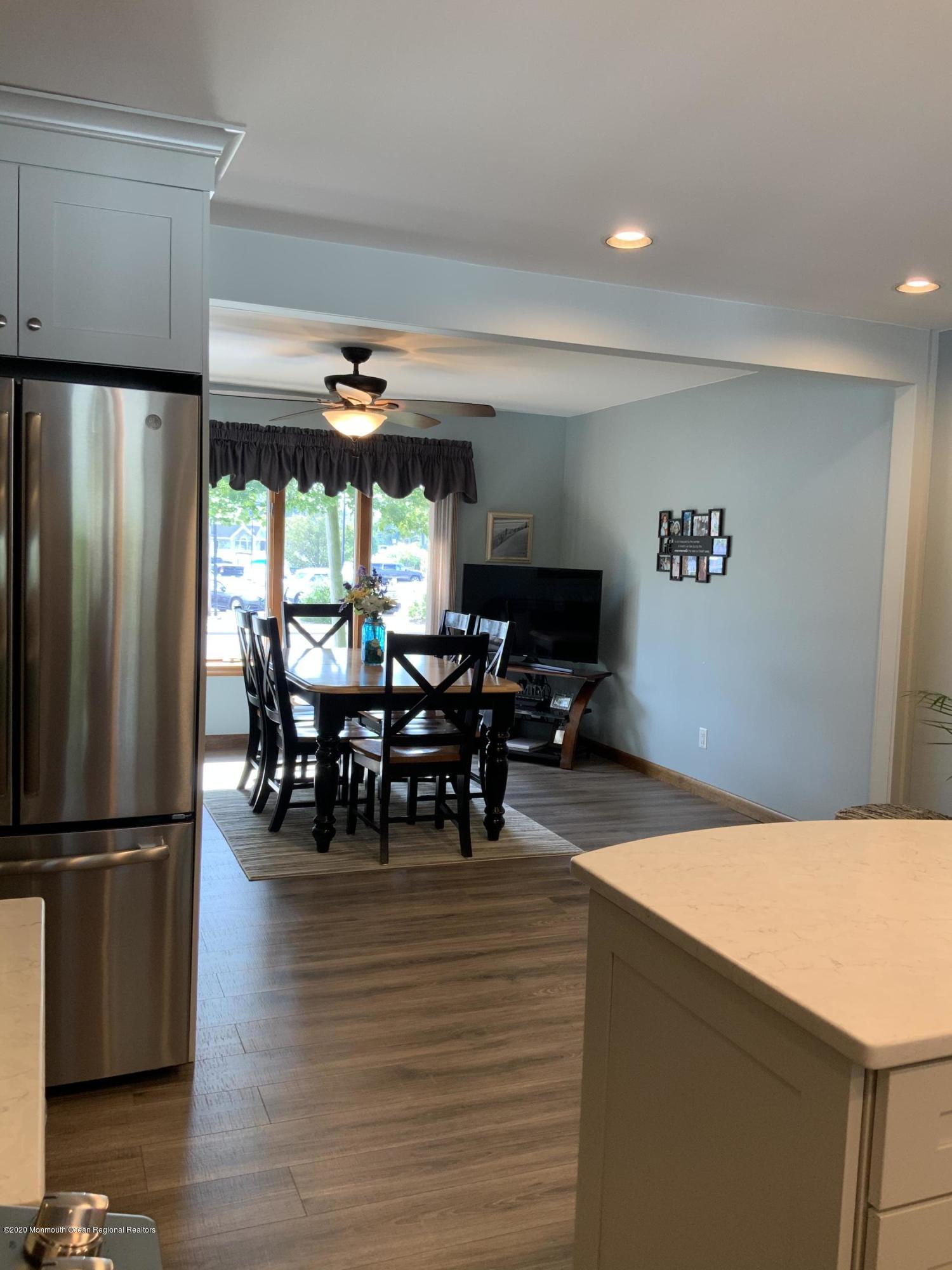 202 Pleasant Drive Brick, NJ 08723 - Photo 36 of 46 a view of a dining room with furniture window and wooden floor
