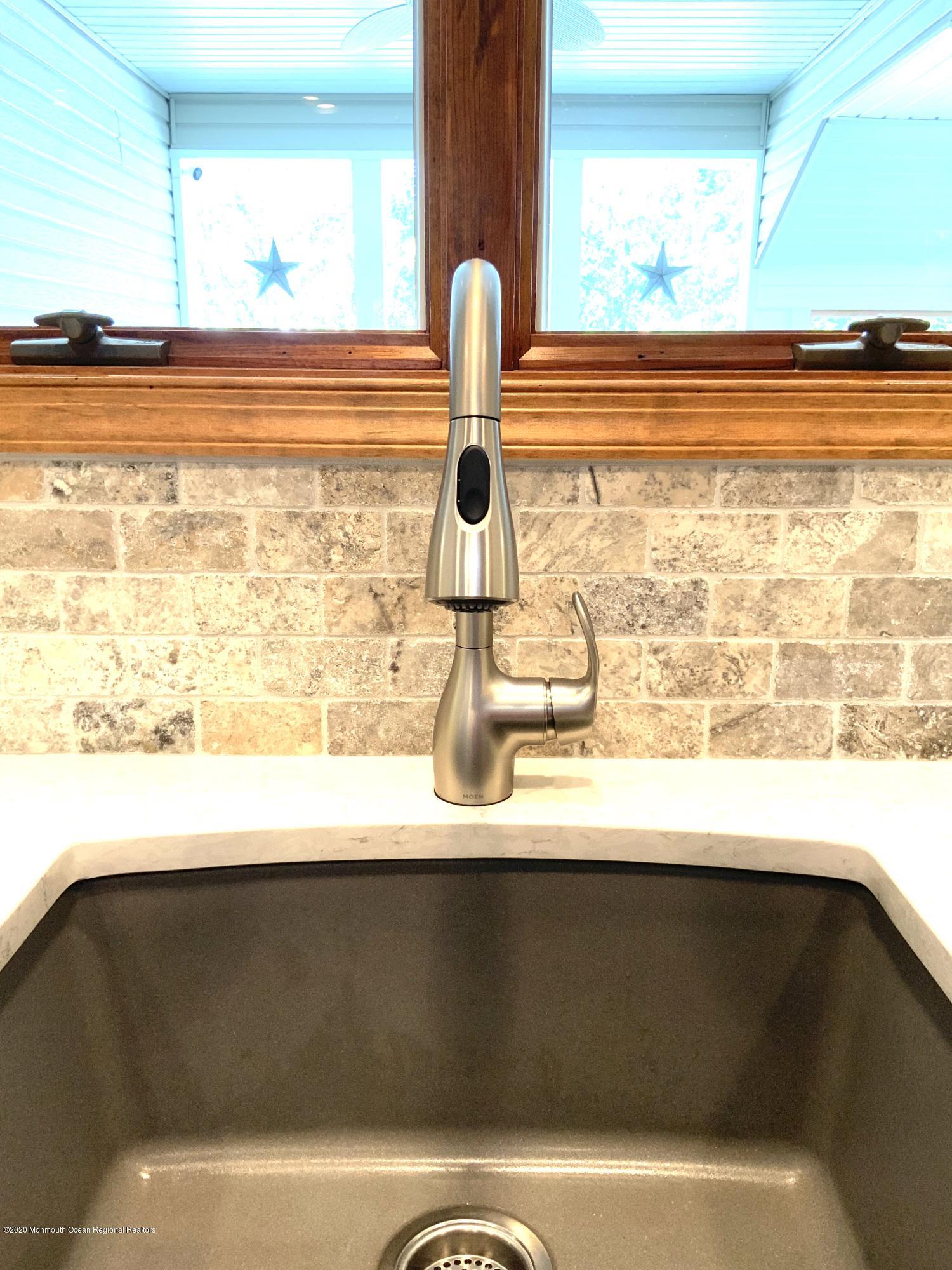 202 Pleasant Drive Brick, NJ 08723 - Photo 8 of 46 a bathroom with a sink and a window