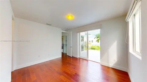 a bathroom with a double vanity sink toilet mirror and shower