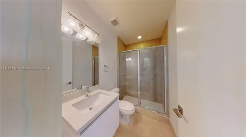 a kitchen that has a sink stainless steel appliances and cabinets