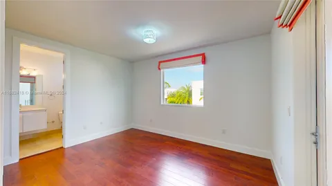 a view of a kitchen with a sink and chandelier
