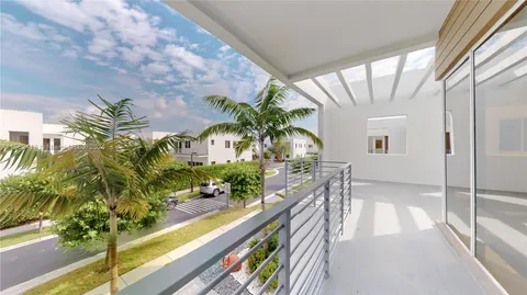 a kitchen with stainless steel appliances granite countertop a sink and a stove