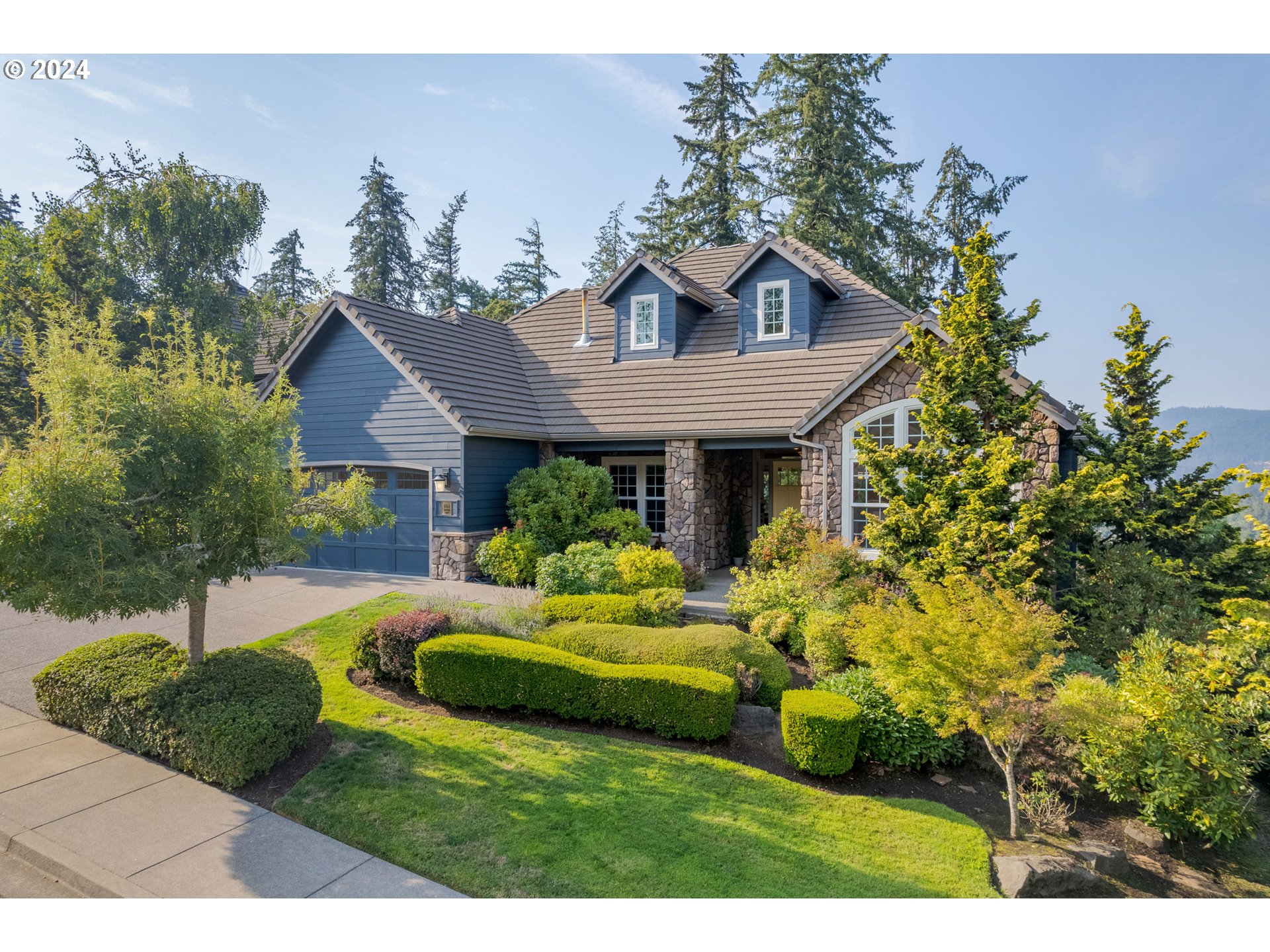 a front view of a house with a yard and porch