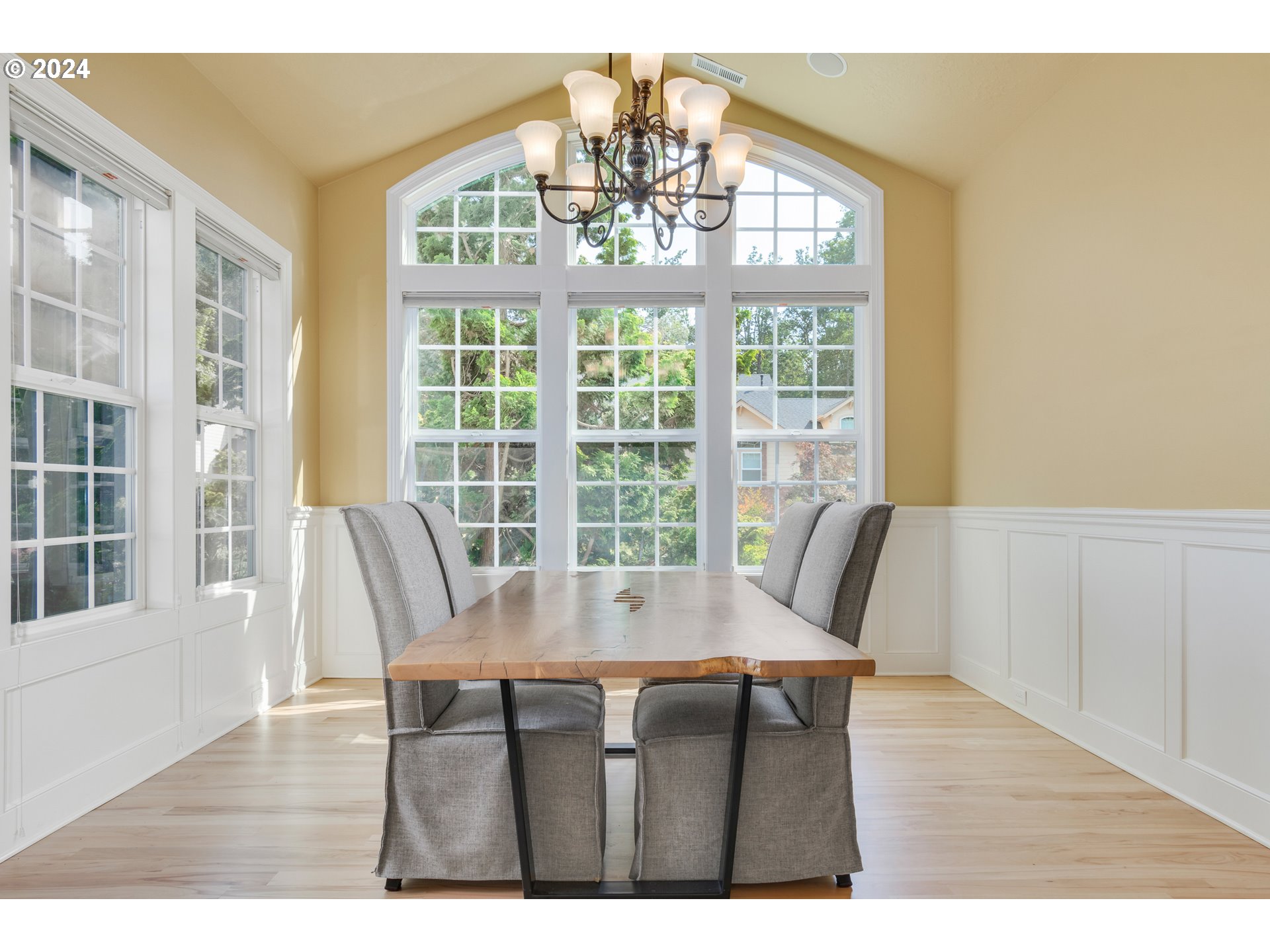6164 Fernhill Loop Springfield, OR 97478 - Photo 18 of 48 a view of a dining room with furniture a chandelier and wooden floor