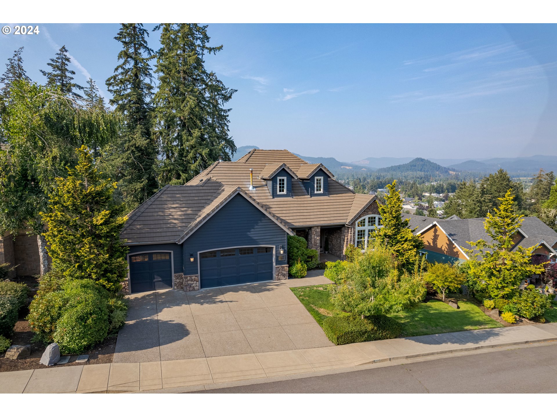 6164 Fernhill Loop Springfield, OR 97478 - Photo 2 of 48 a front view of a house with a yard and potted plants