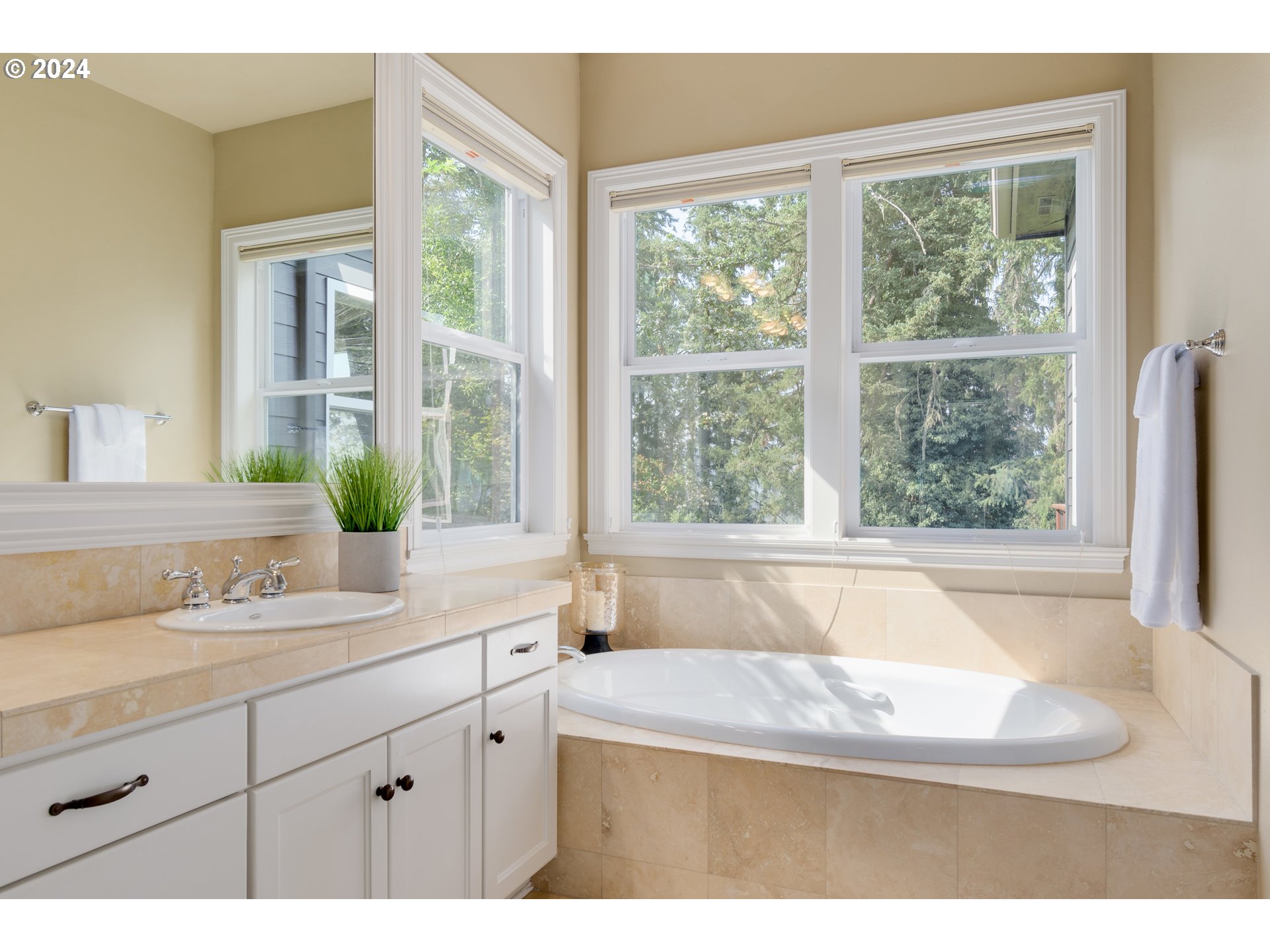 6164 Fernhill Loop Springfield, OR 97478 - Photo 26 of 48 a bathroom with a granite countertop sink and a bathtub next to a window