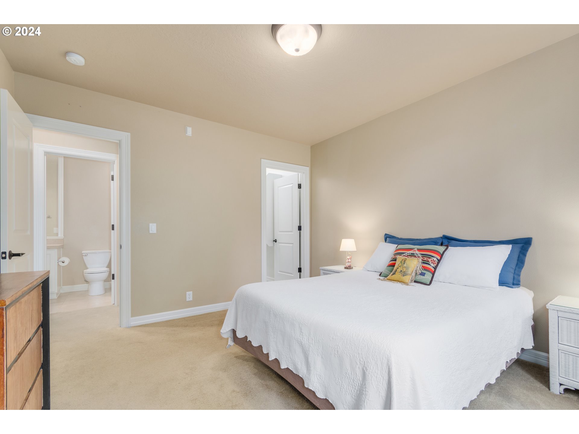 6164 Fernhill Loop Springfield, OR 97478 - Photo 33 of 48 a bedroom with a bed and a night stand