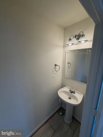 a view of an empty room and wooden floor