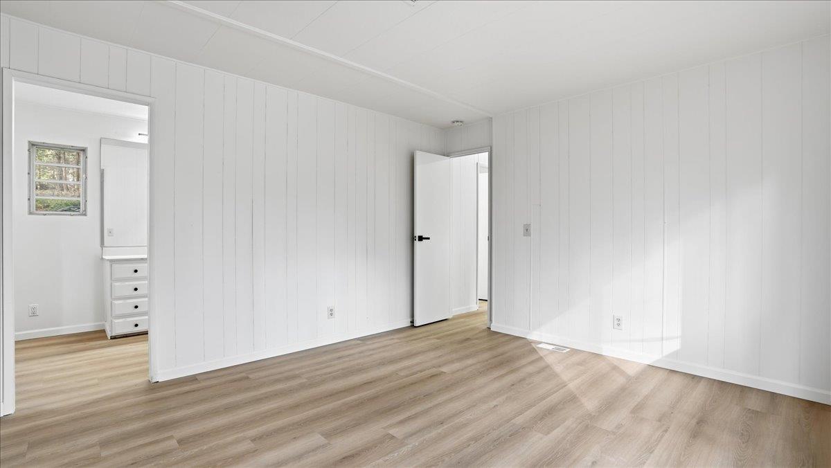 5840 Pony Express Trail, Unit 46 Pollock Pines, CA 95726 - Photo 15 of 22 an empty room with wooden floor