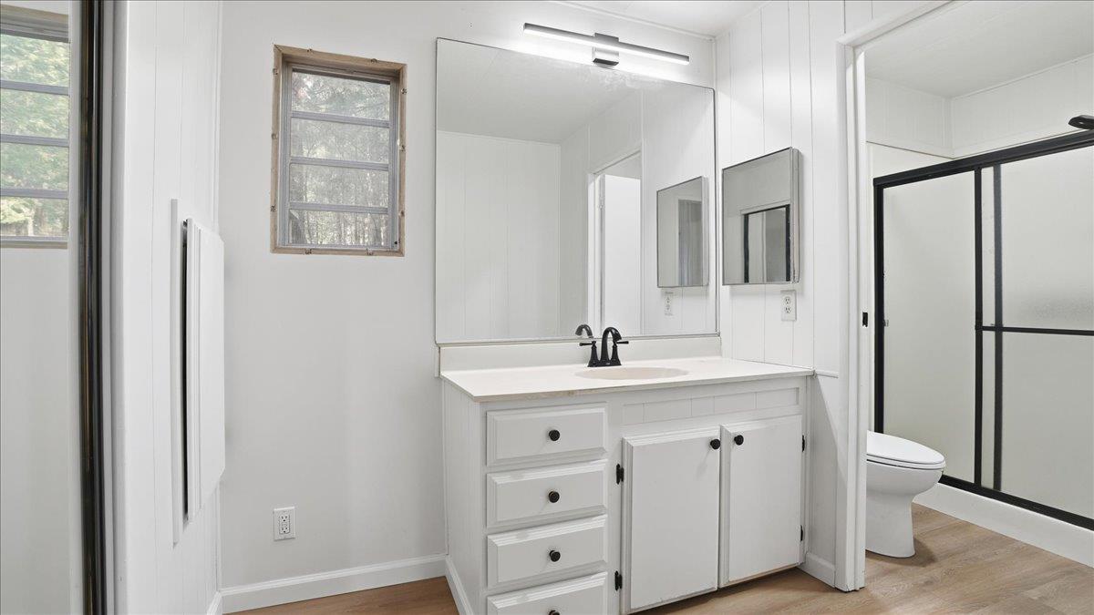 5840 Pony Express Trail, Unit 46 Pollock Pines, CA 95726 - Photo 16 of 22 a bathroom with a double vanity sink a mirror and a bathtub