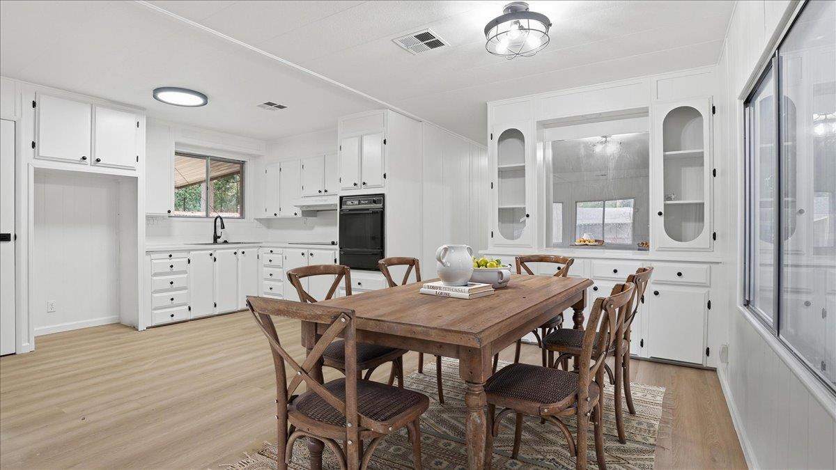 5840 Pony Express Trail, Unit 46 Pollock Pines, CA 95726 - Photo 8 of 22 a view of a dining room with furniture and wooden floor