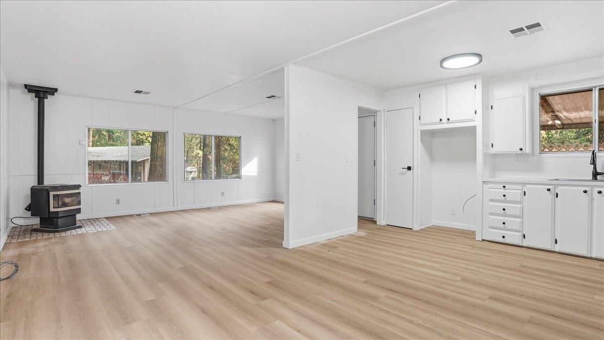 5840 Pony Express Trail, Unit 46 Pollock Pines, CA 95726 - Photo 10 of 22 a view of a bedroom with wooden floor and windows