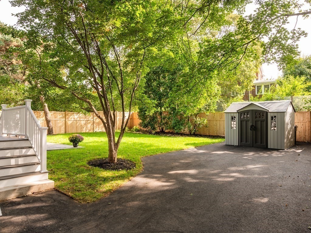 8 Lovell Road Watertown, MA 02472 - Photo 5 of 42 a front view of a house with garden