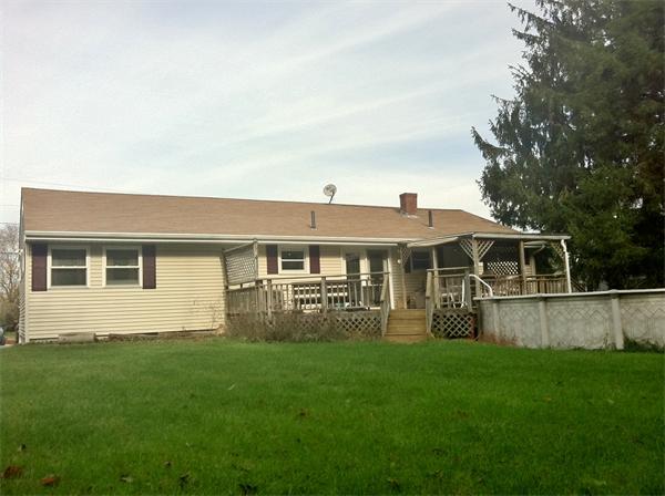 231 Lepes Road Somerset, MA 02726 - Photo 18 of 19 a front view of house with yard and green space