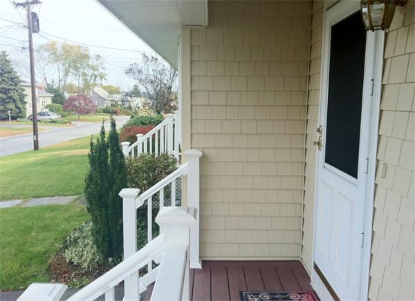 231 Lepes Road Somerset, MA 02726 - Photo 2 of 19 a view of balcony with wooden floor and fence