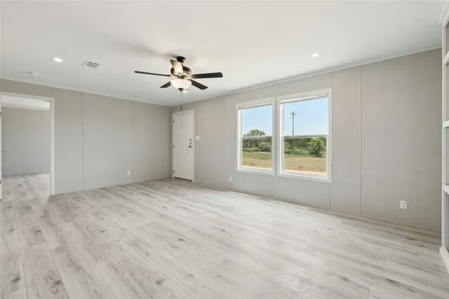 a view of an empty room with a window