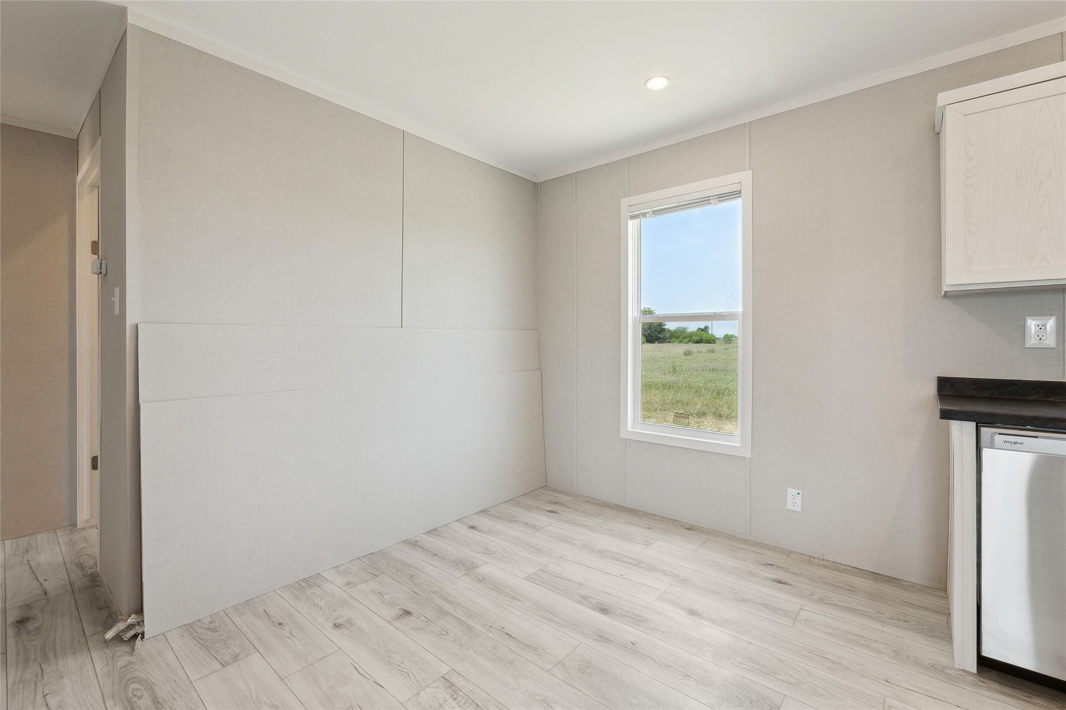 1287 Cr 402 Roads, Unit LOT 17 Flatonia, TX 78941 - Photo 15 of 37 Unfurnished dining area with light wood-type flooring and ornamental molding