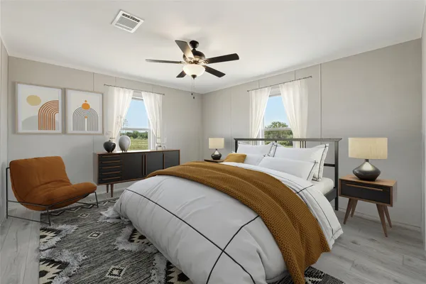 a bedroom with a bed and furniture