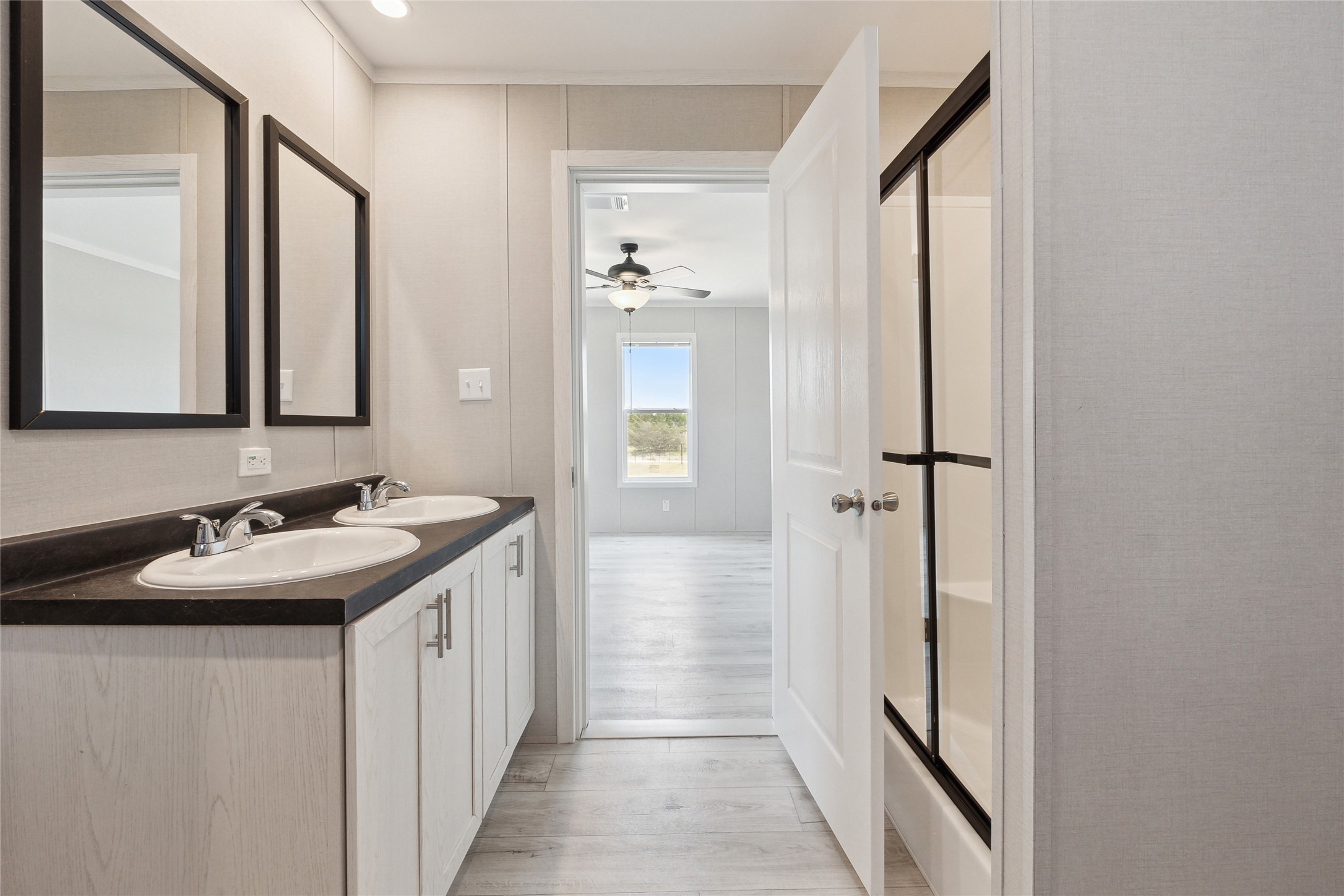 1287 Cr 402 Roads, Unit LOT 17 Flatonia, TX 78941 - Photo 30 of 37 Full bath with wood finished floors, double vanity, and ceiling fan