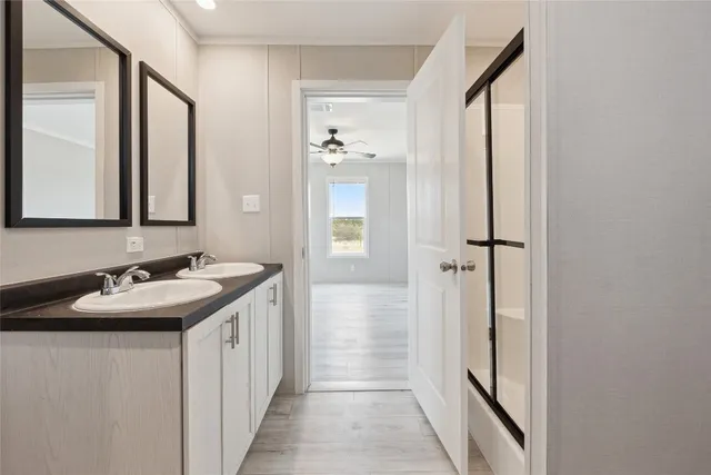 a bathroom with a sink and mirror