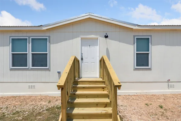 a view of entryway with wooden floor