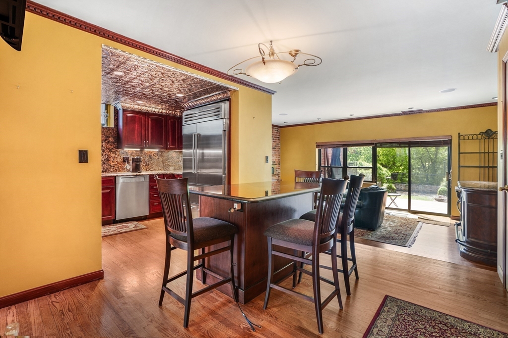 131 Perkins Street, Unit 131 Boston, MA 02130 - Photo 1 of 21 a view of a dining room with furniture window and wooden floor