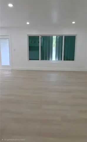 a view of an empty room with windows