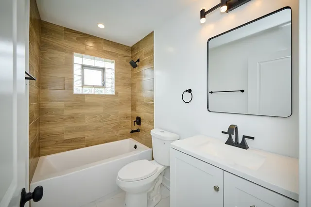 a bathroom with a sink a toilet and a bathtub