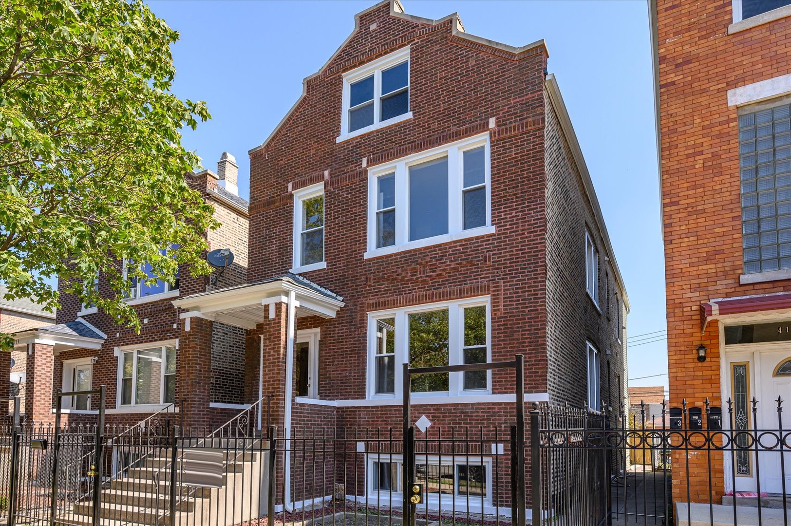 4141 South Albany Avenue Chicago, IL 60632 - Photo 1 of 2 a front view of a house with glass windows