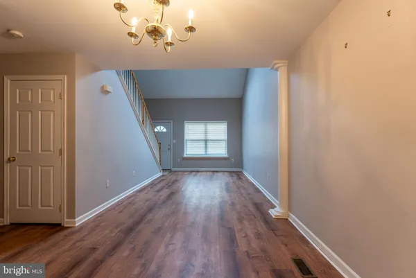 a view of a livingroom with wooden floor