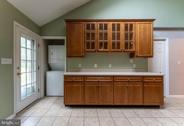 a kitchen with a cabinets and window