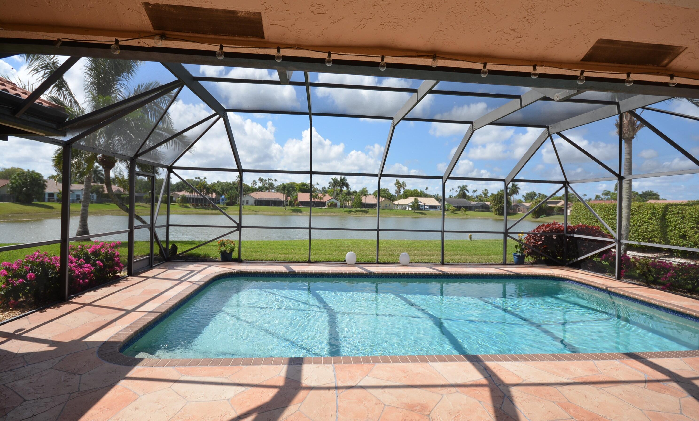 11330 Lake Tree Court Boca Raton, FL 33498 - Photo 5 of 33 Screened Patio & Pool with Lakeviews