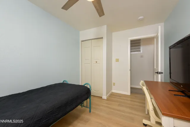 a room with a bed and a flat screen tv