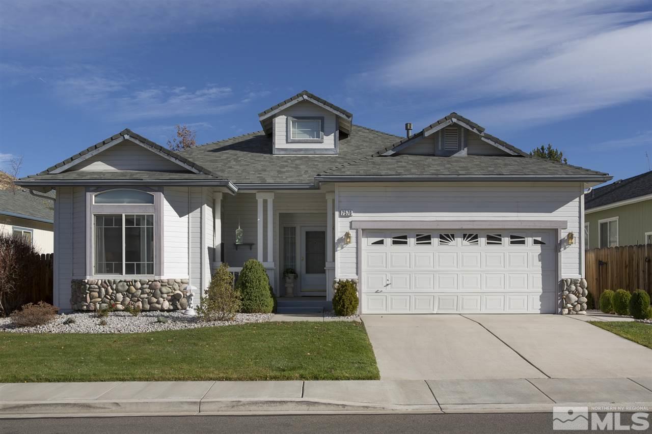 7570 Michaela Drive Reno, NV 89511 - Photo 1 of 1 a front view of a house with a yard